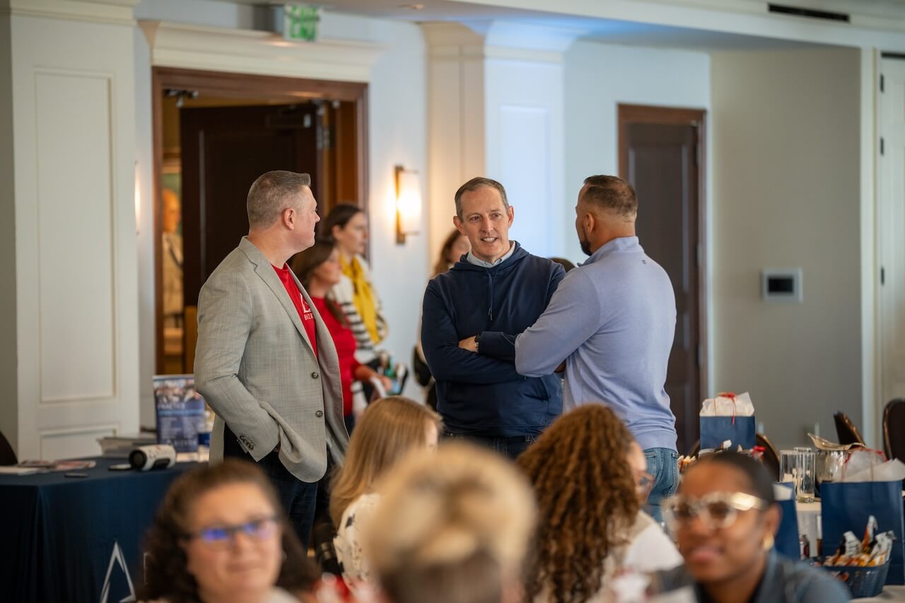 Business owners networking at a BIZROK event