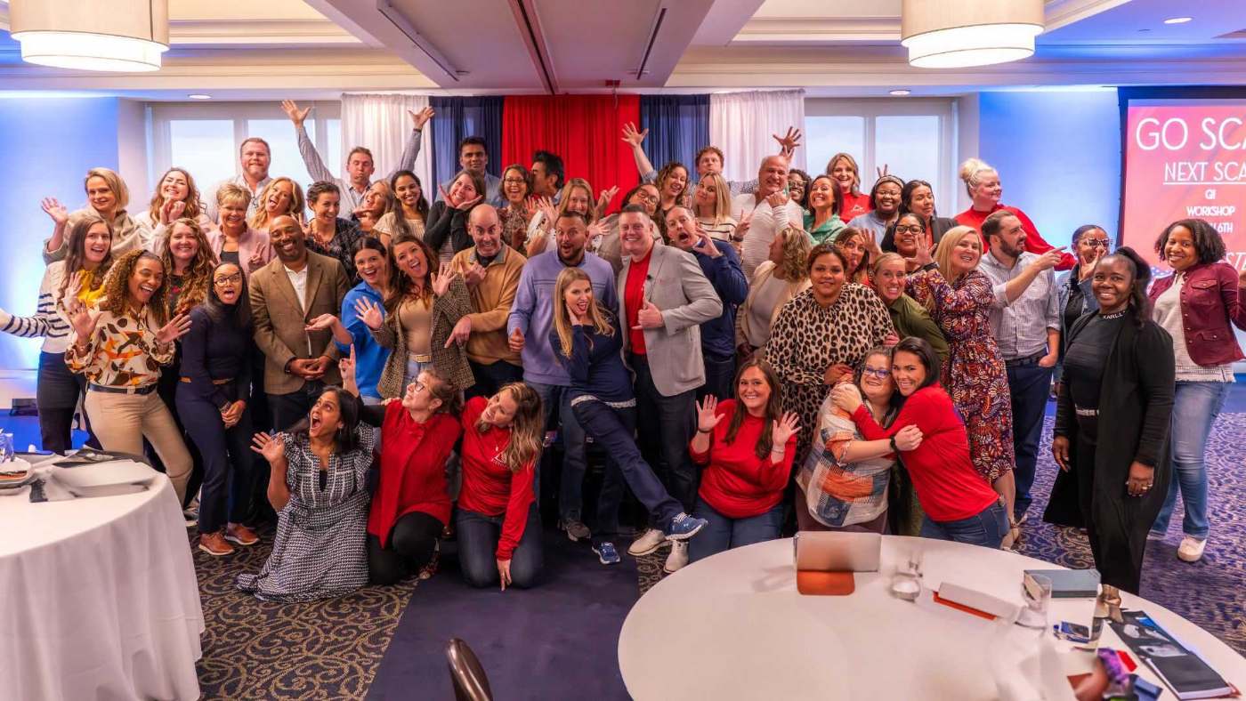 Group photo of BIZROK event attendees celebrating